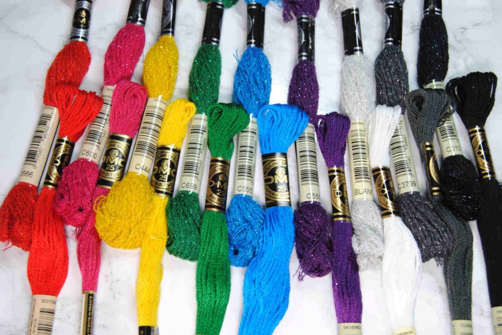 Comparing skeins of DMC Mouliné Étoile to DMC Stranded Cotton of the same color