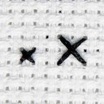 Stitched example of stitching cross stitch over 2.