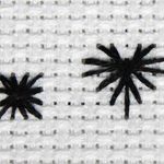 Stitched example of a rhodes stitch and a rhodes heart stitch.