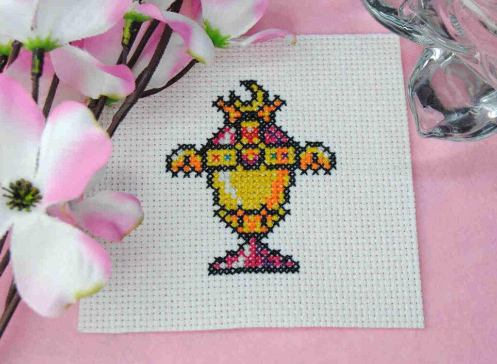 A cross stitch of the Sailor Moon Holy Grail / Rainbow Moon Chalice stitched in Mouliné Étoile threads