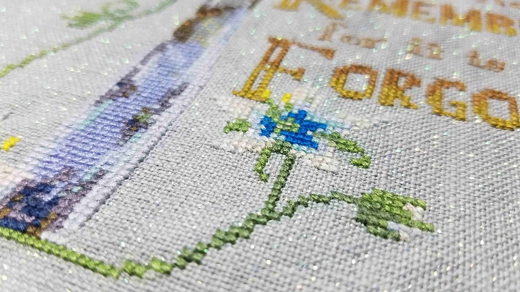 Closeup of a Legend of Zelda cross stitch featuring a Silent Princess flower.