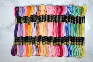 A collection of Anchor brand variegated thread skeins.
