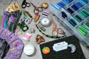 An assortment of gift ideas for cross stitchers ranging from needle minders to hand dyed fabrics.