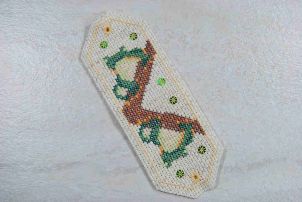 An example of the flat omamori shape with aida trimmed close to the backstitch prior to assembly.