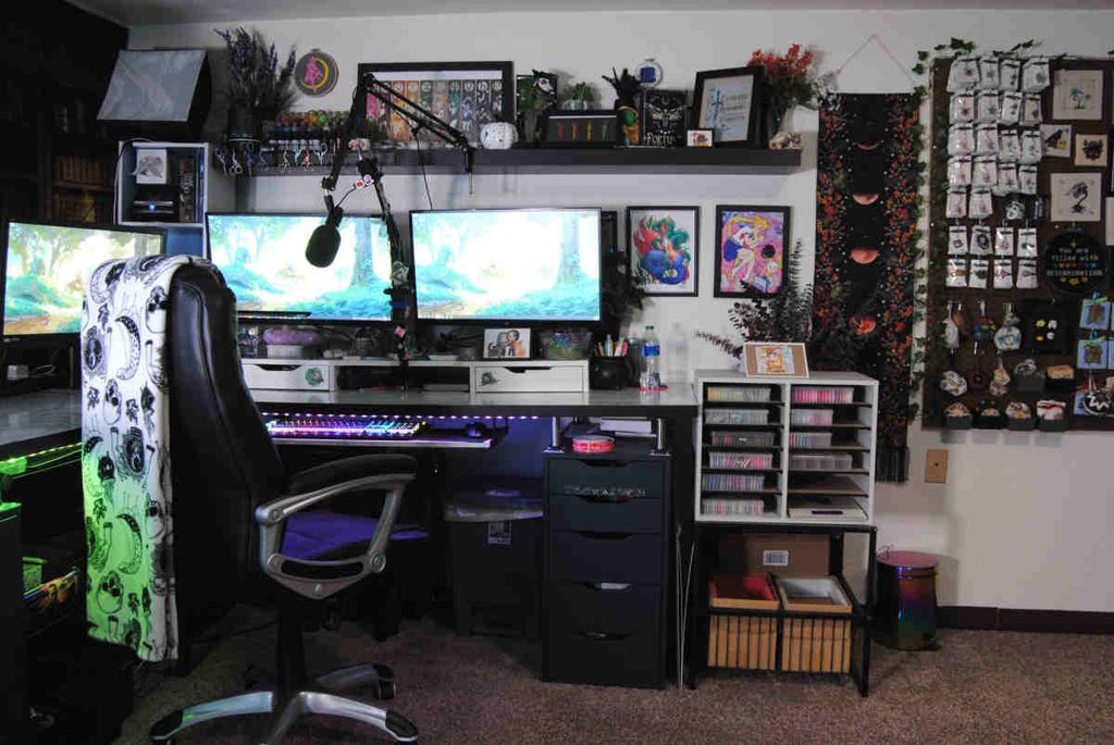 Office desk in a craft room with a pegboard on the wall.