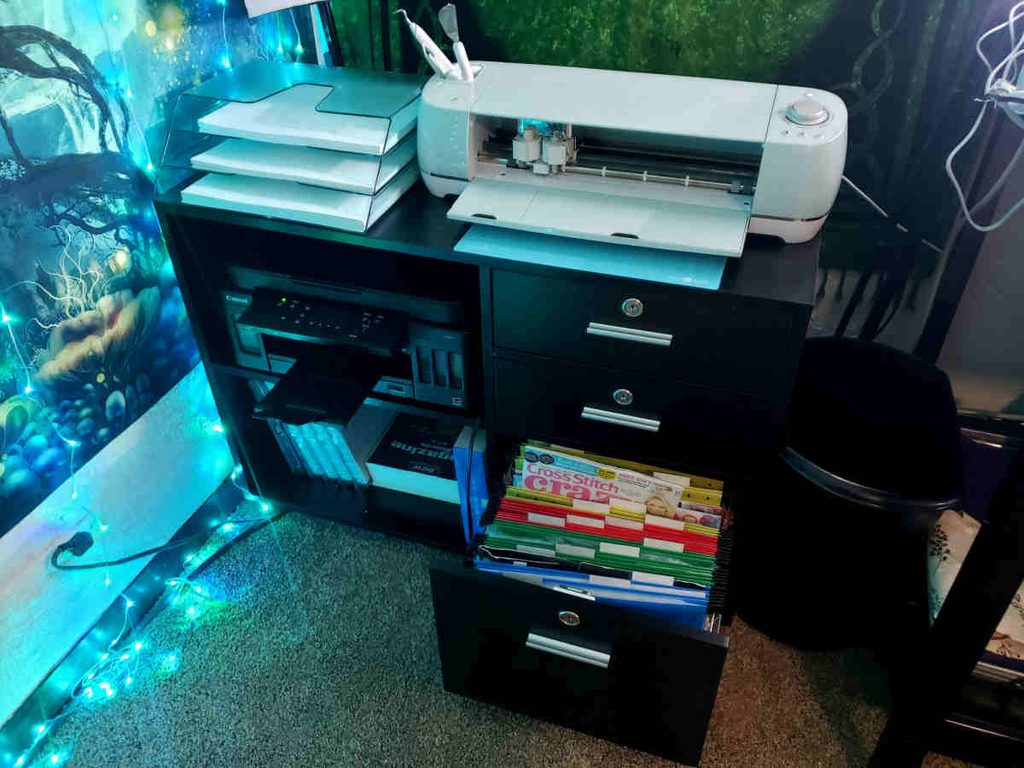 Printer desk with a file cabinet drawer and a cricut on top