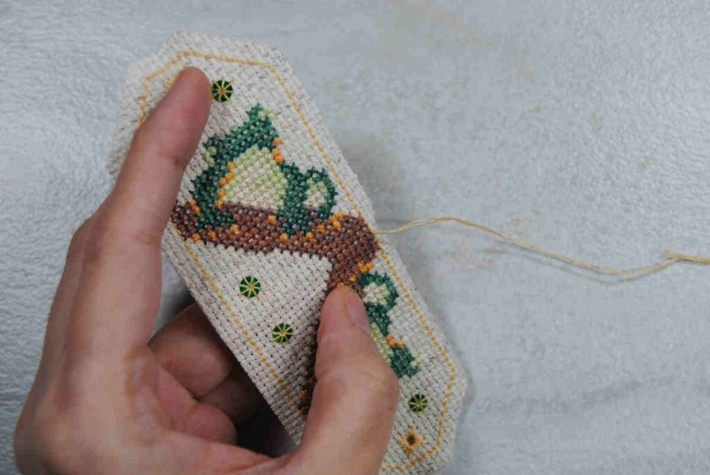 Starting your thread in the middle of one of the sides of your cross stitch omamori.