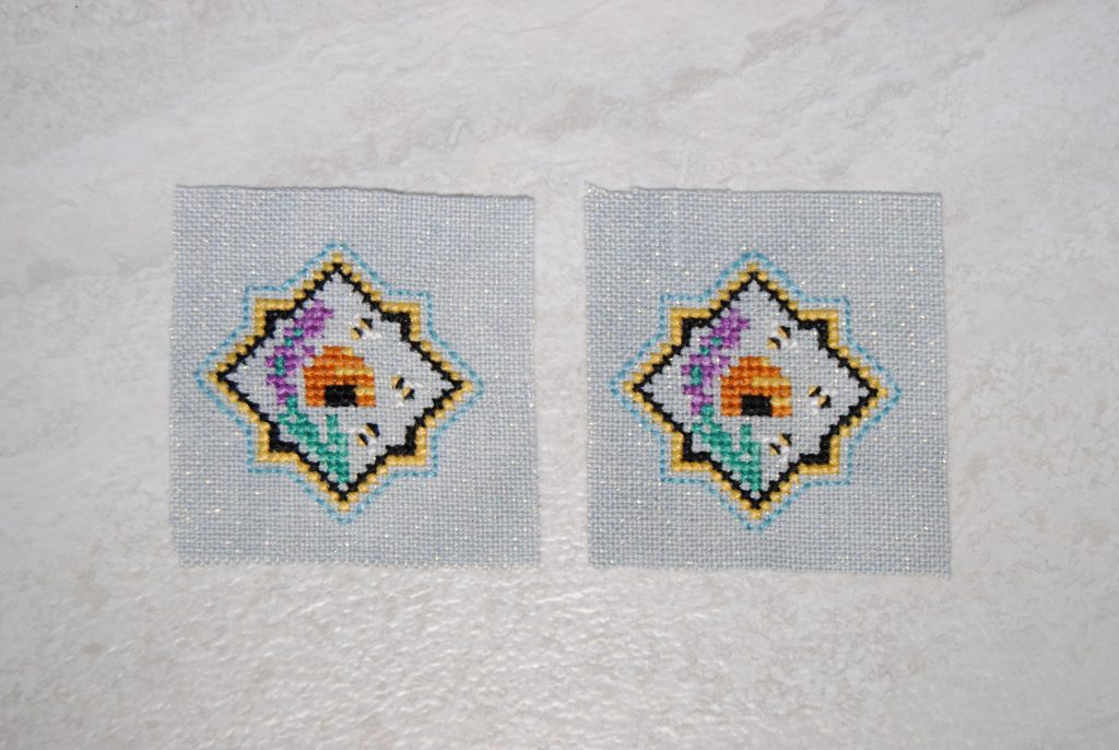 A bee themed small cross stitch featuring a beehive and lavender