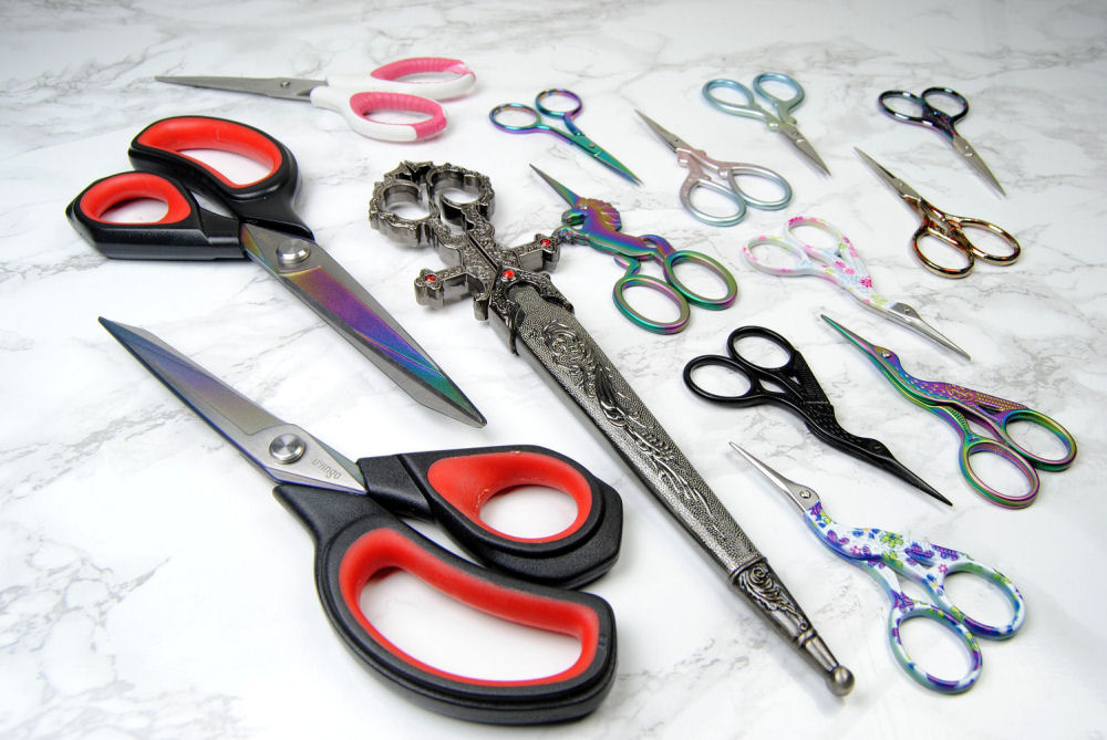A group of different sized scissors ranging from fabric scissors to small embroidery scissors
