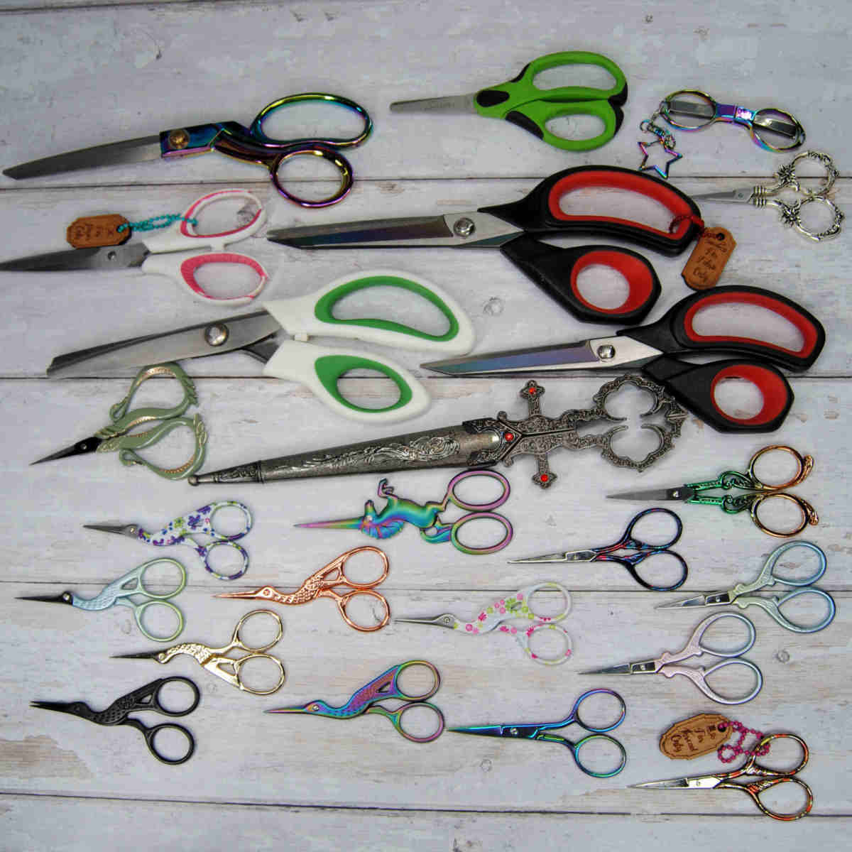 A group of different sized scissors ranging from fabric scissors to small embroidery scissors