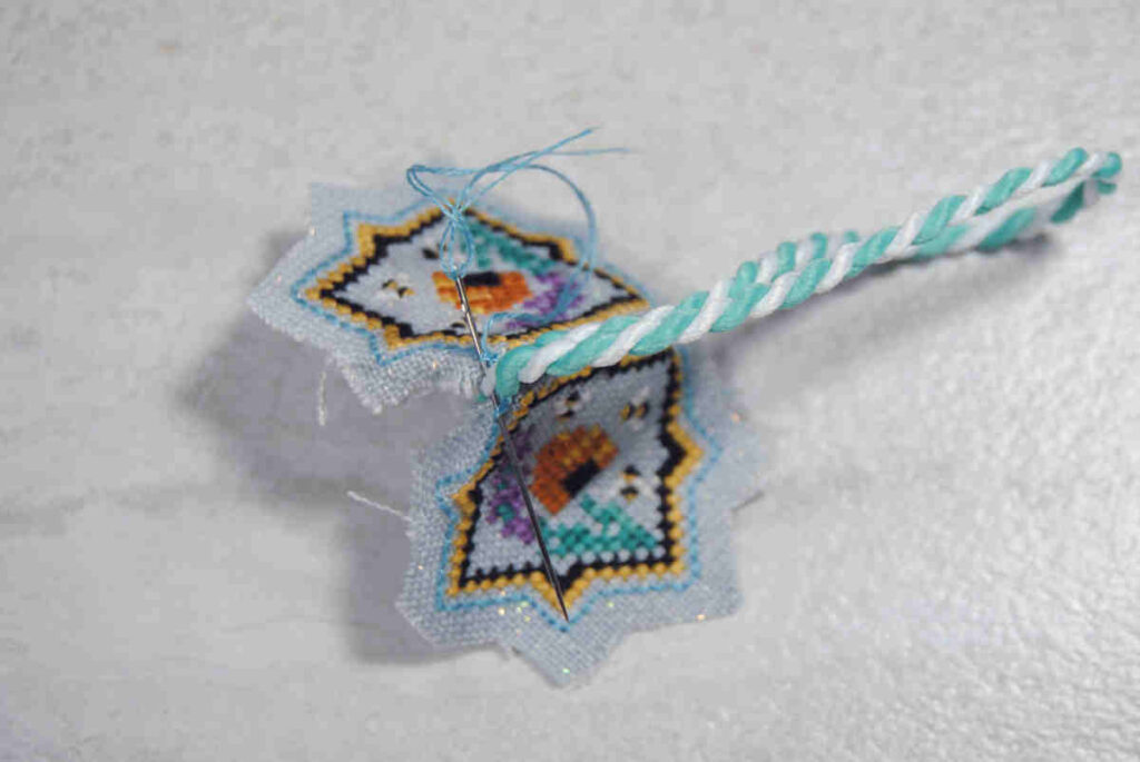 Demonstration on how to attach a cord to your scissor fob during the assembly phase