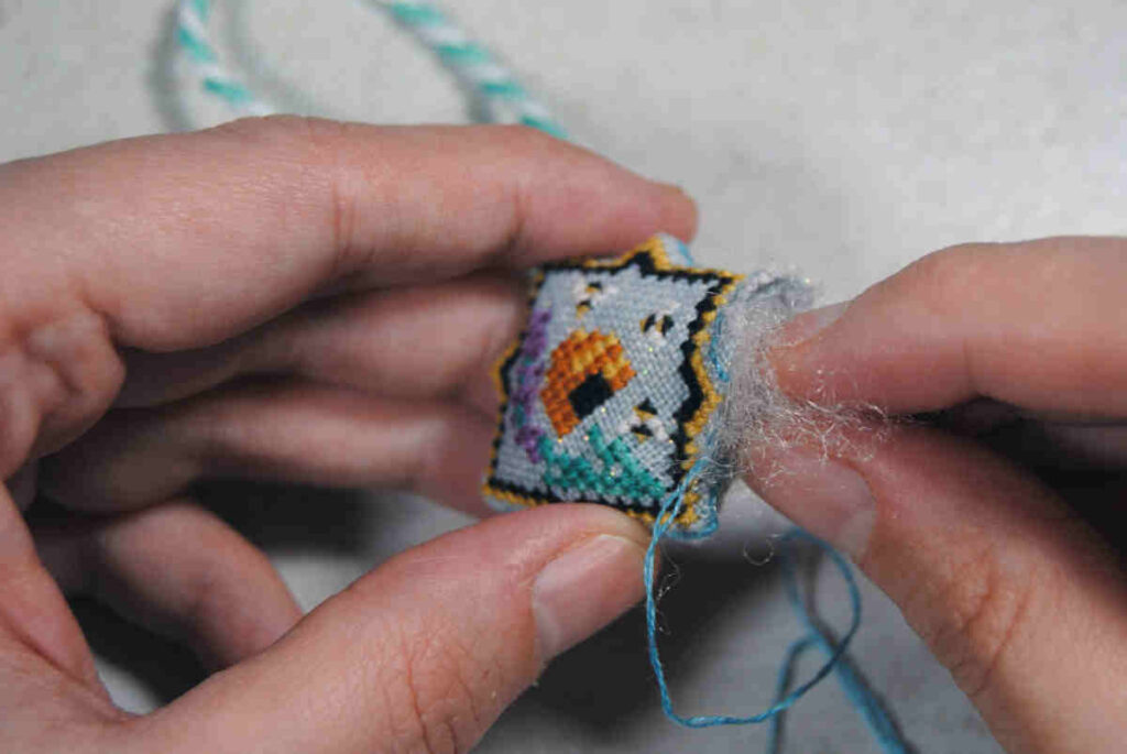 Use polyfil, orts, or even dryer lint to stuff your scissor fob.