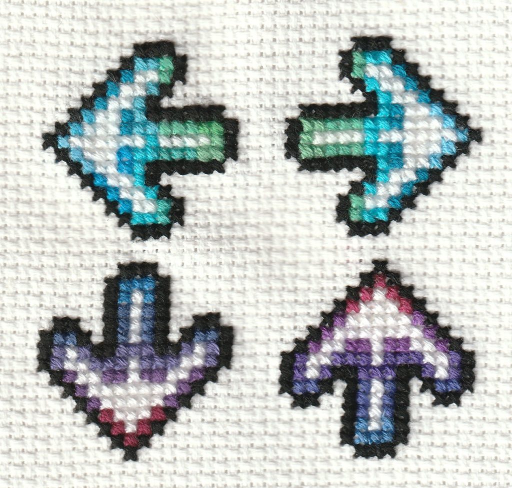 DDR arrows cross stitched to compare two brands of thread