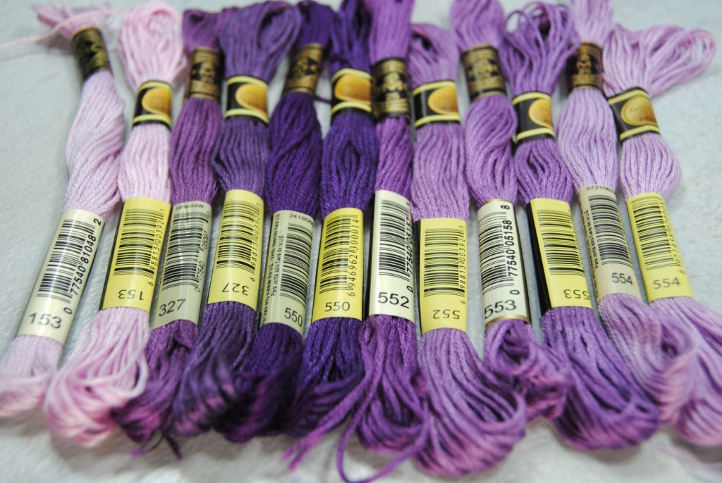 Color comparison of CXC and DMC threads, all within the purple color family.