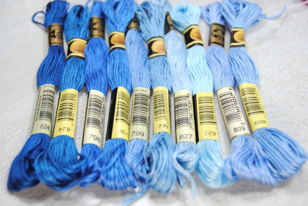 Color comparison of CXC and DMC threads, all within the blue color family.
