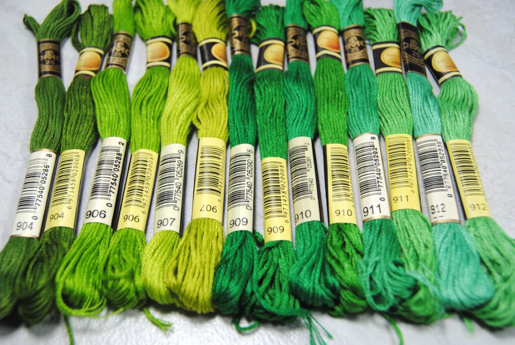 Color comparison of CXC and DMC threads, all within the green color family.