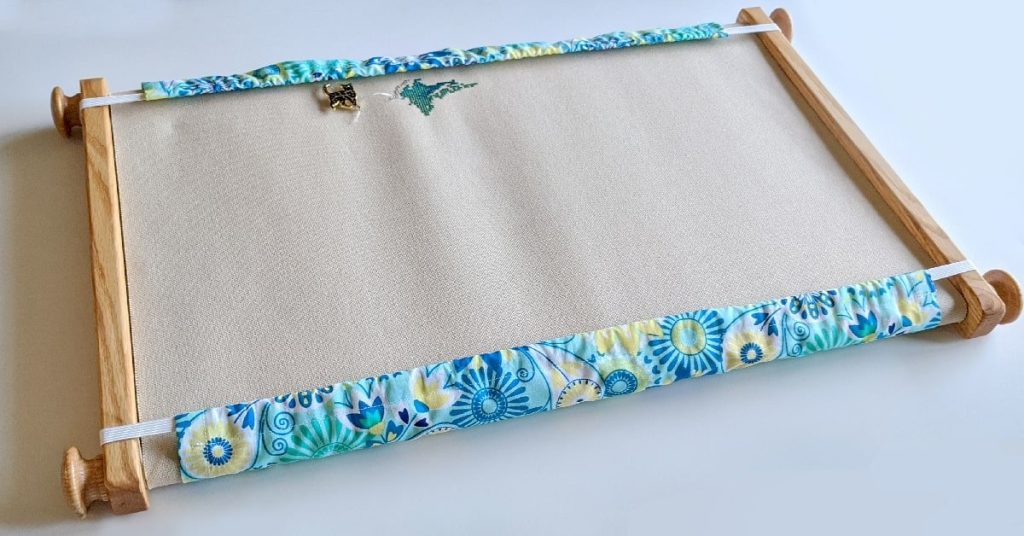 example of a scroll frame grime guard from littlelionstitchery.com